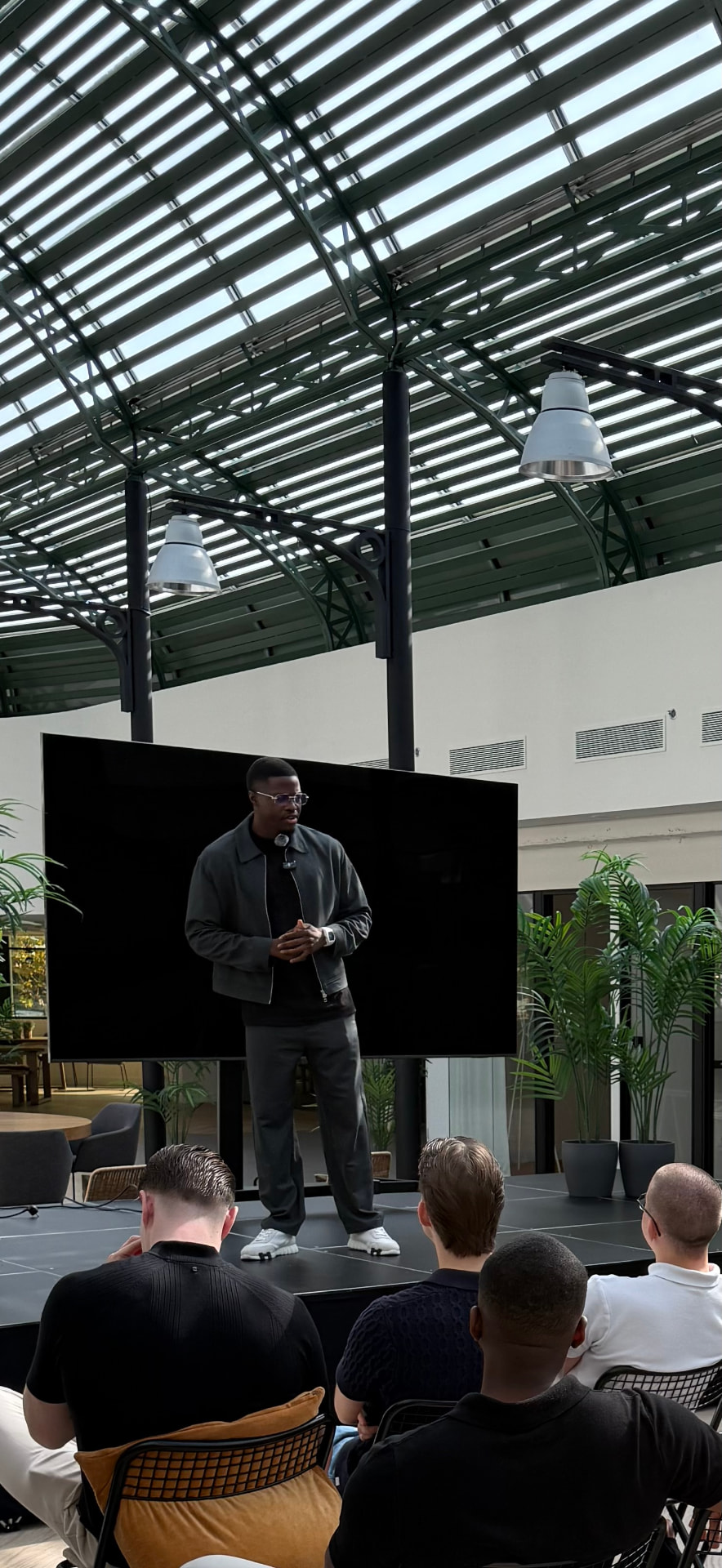 JOËL MBANG speaking live on stage